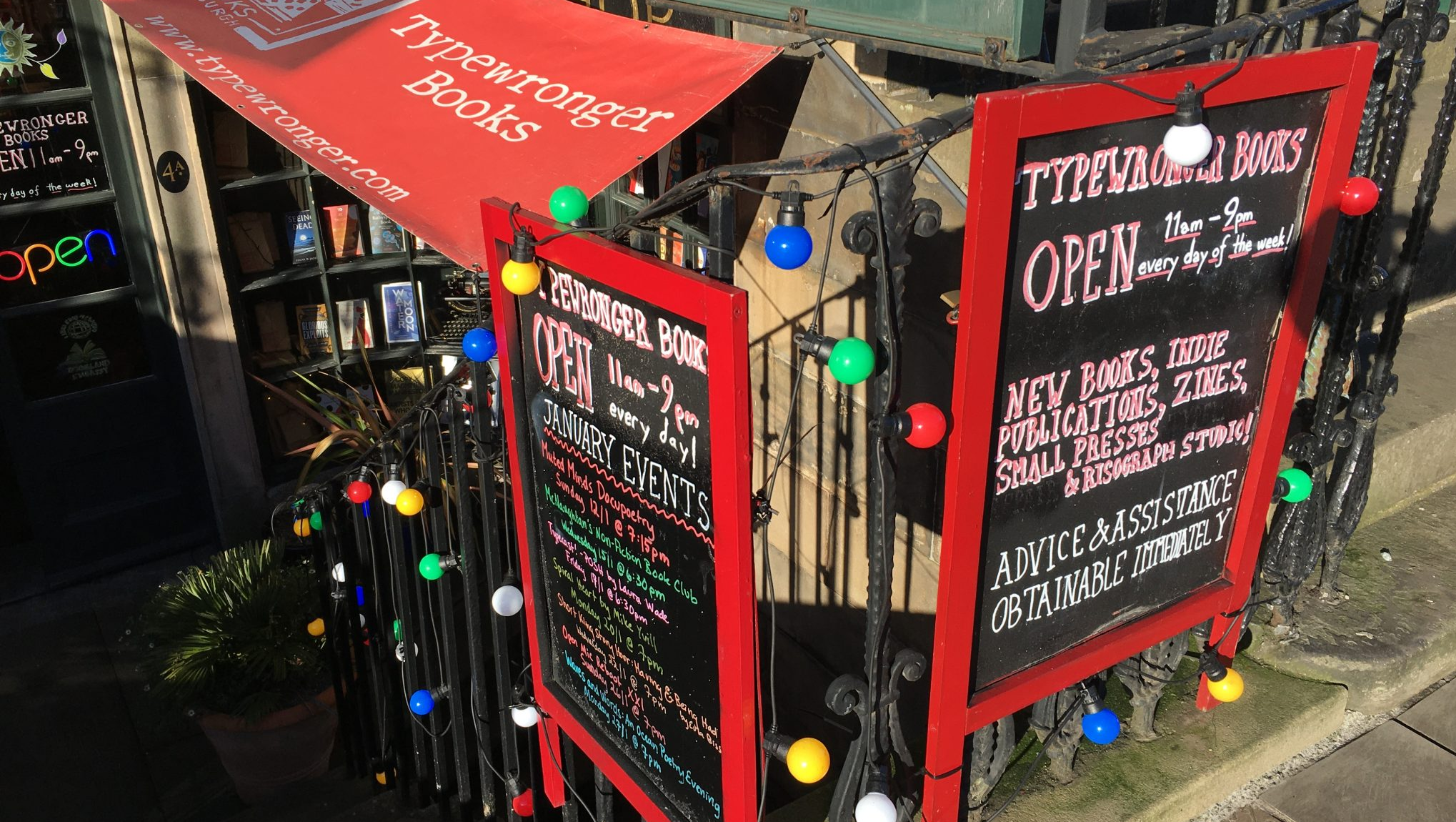 The blackboards on the front of the shop one sunny day. They show our opening hours - every day of the week 11am-9pm
